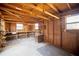 Workshop featuring exposed framing, wood walls, shelving, and windows at 4453 White Oak Dr, Sugar Hill, GA 30518