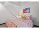 Cozy bedroom with floral bedding and abstract art at 5200 Peachtree Rd # 3116, Chamblee, GA 30341