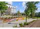 Walking path with colorful mural and landscaping at 5200 Peachtree Rd # 3116, Chamblee, GA 30341
