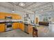 Open concept kitchen with island and stainless steel appliances at 5200 Peachtree Rd # 3116, Chamblee, GA 30341
