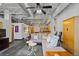 Open living area with exposed ductwork and large area rug at 5200 Peachtree Rd # 3116, Chamblee, GA 30341