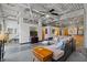 Open living room with exposed beams, concrete floors, and modern furniture at 5200 Peachtree Rd # 3116, Chamblee, GA 30341