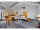 Open living area with exposed ductwork and large area rug at 5200 Peachtree Rd # 3116, Chamblee, GA 30341