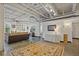 Open living area with exposed ductwork and large area rug at 5200 Peachtree Rd # 3116, Chamblee, GA 30341