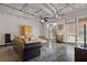 Open living area with exposed ductwork and large area rug at 5200 Peachtree Rd # 3116, Chamblee, GA 30341