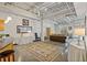 Open living area with exposed ductwork and large area rug at 5200 Peachtree Rd # 3116, Chamblee, GA 30341
