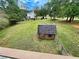 Large backyard with playhouse, providing ample outdoor space at 305 Rampart St, Mcdonough, GA 30253