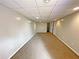 View of a finished basement area with carpeted floors and access to other rooms at 305 Rampart St, Mcdonough, GA 30253