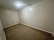 View of a bedroom with a ceiling light and carpeted floors at 305 Rampart St, Mcdonough, GA 30253