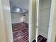 Bedroom view to closet showing rod and shelves at 305 Rampart St, Mcdonough, GA 30253