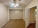 Bedroom featuring a ceiling fan, neutral walls, and a closet at 305 Rampart St, Mcdonough, GA 30253