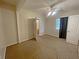 Bedroom with a window, a ceiling fan, and a bathroom entrance at 305 Rampart St, Mcdonough, GA 30253