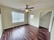 Bedroom with hardwood floors, closet and a ceiling fan at 305 Rampart St, Mcdonough, GA 30253