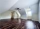 Large bonus room featuring a unique ceiling and hardwood floors at 305 Rampart St, Mcdonough, GA 30253