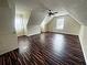 Large bonus room featuring a unique ceiling and hardwood floors at 305 Rampart St, Mcdonough, GA 30253