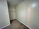 View of a closet with carpeted floors and clothes rails at 305 Rampart St, Mcdonough, GA 30253