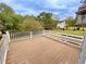 Spacious deck with white railings, offering scenic backyard views at 305 Rampart St, Mcdonough, GA 30253