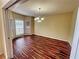 Bright dining room features hardwood floors and a bay window at 305 Rampart St, Mcdonough, GA 30253