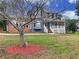 Two-story house with gray siding, brick accents, and a front yard at 305 Rampart St, Mcdonough, GA 30253