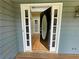 Elegant front door with glass accents opens to a hardwood foyer at 305 Rampart St, Mcdonough, GA 30253