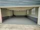 Clean and well-lit garage interior with epoxy flooring at 305 Rampart St, Mcdonough, GA 30253