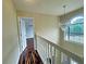 Bright hallway with wood floors, and a chandelier near a window with natural light at 305 Rampart St, Mcdonough, GA 30253