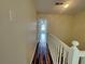 Hallway showing hardwood floors and bright lighting at 305 Rampart St, Mcdonough, GA 30253