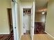 Convenient hallway with coat closet and access to other rooms at 305 Rampart St, Mcdonough, GA 30253