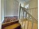 Upstairs hallway featuring hardwood-style floors and white painted trim and doors at 305 Rampart St, Mcdonough, GA 30253