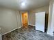 Eat-in-kitchen with dark flooring and white refrigerator at 305 Rampart St, Mcdonough, GA 30253