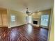 Spacious living room with hardwood floors, fireplace and lots of natural light at 305 Rampart St, Mcdonough, GA 30253