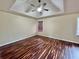 Bright main bedroom with a trey ceiling, a ceiling fan, hardwood floors, and natural light at 305 Rampart St, Mcdonough, GA 30253