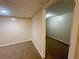 Room with neutral paint and carpeting. The room has drop ceiling tiles and recessed lighting at 305 Rampart St, Mcdonough, GA 30253