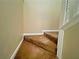 Carpeted staircase leading to the next level, featuring white trim and neutral wall colors at 305 Rampart St, Mcdonough, GA 30253
