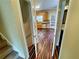 View from stairs leading to the kitchen featuring warm cabinets and modern appliances at 305 Rampart St, Mcdonough, GA 30253