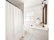 Clean bathroom with white vanity, tile shower, and modern fixtures at 3512 Casa Woods Ln, Clarkston, GA 30021