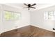 Bright bedroom featuring hardwood floors and ample natural light at 3512 Casa Woods Ln, Clarkston, GA 30021