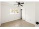 Simple bedroom with ceiling fan and closet at 3512 Casa Woods Ln, Clarkston, GA 30021
