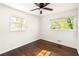 Well-lit bedroom with hardwood floors and ceiling fan at 3512 Casa Woods Ln, Clarkston, GA 30021