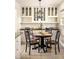 Small dining area with round table and chairs, built-in cabinets above at 3512 Casa Woods Ln, Clarkston, GA 30021