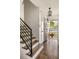 Inviting entryway with hardwood floors and modern staircase at 3512 Casa Woods Ln, Clarkston, GA 30021