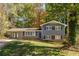 Updated ranch home with gray siding and a neatly landscaped lawn at 3512 Casa Woods Ln, Clarkston, GA 30021