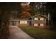 Two-story house with gray siding, brick accents, and a landscaped yard at 3512 Casa Woods Ln, Clarkston, GA 30021
