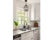 Kitchen features white cabinets, granite counters, and a farmhouse sink at 3512 Casa Woods Ln, Clarkston, GA 30021