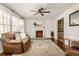 Cozy living room with fireplace, hardwood floors, and comfortable seating at 3512 Casa Woods Ln, Clarkston, GA 30021