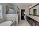Elegant bathroom with double vanity, soaking tub, and a separate shower at 1190 Smithwell Pt, Kennesaw, GA 30152