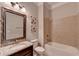Bathroom boasts granite vanity, tiled shower, and a bathtub at 1190 Smithwell Pt, Kennesaw, GA 30152