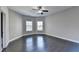 Spacious bedroom with dark hardwood floors and a ceiling fan at 1190 Smithwell Pt, Kennesaw, GA 30152