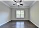 Bright bedroom with hardwood floors and a large window at 1190 Smithwell Pt, Kennesaw, GA 30152
