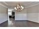 Formal dining room with hardwood floors and elegant chandelier at 1190 Smithwell Pt, Kennesaw, GA 30152